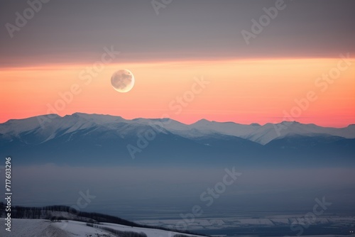 lunar eclipse over mountain range silhouette © studioworkstock