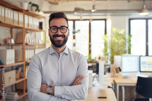 Confident professional in office environment smiling at camera