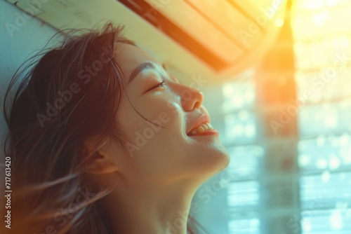 A woman is smiling and looking up at the sky. This picture can be used to depict happiness, joy, or wonder