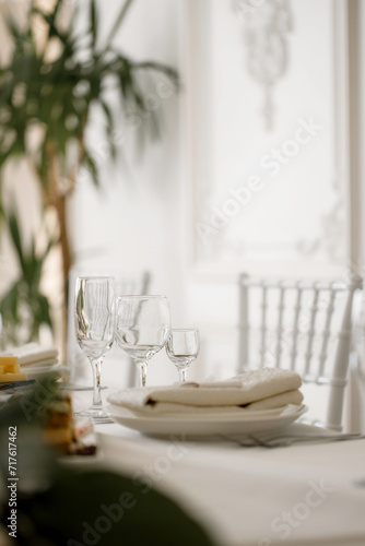 Table setting  glasses for drinks  plates  flowers