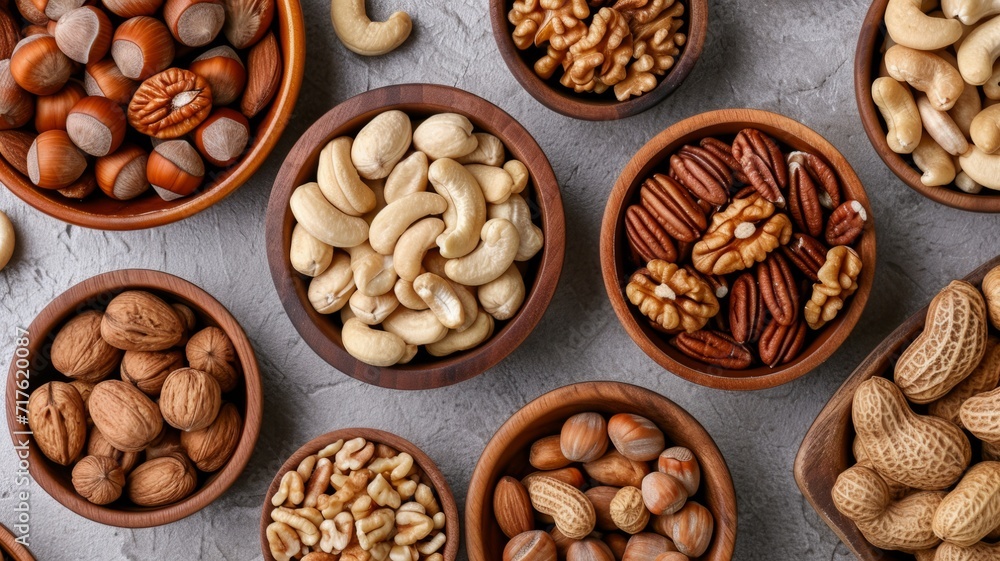 Background with different varieties of nuts. Top view of various nuts Background with different varieties of nuts. Top view of various nuts