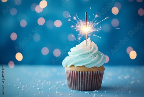 a cupcake with glitter on a blue background