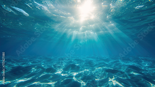Blue sea underwater background with rays sunlight shining © kraftbunnies