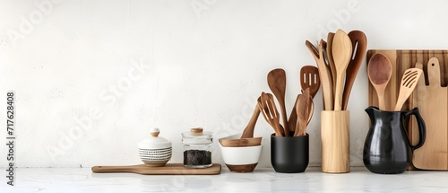 kitchen utensils, set of kitchen utensils on table against light background with space for text photo