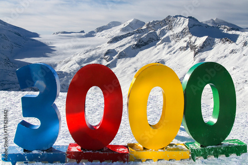3000 colourful tourist inscription glacier view on the mountains of the tonale pass photo