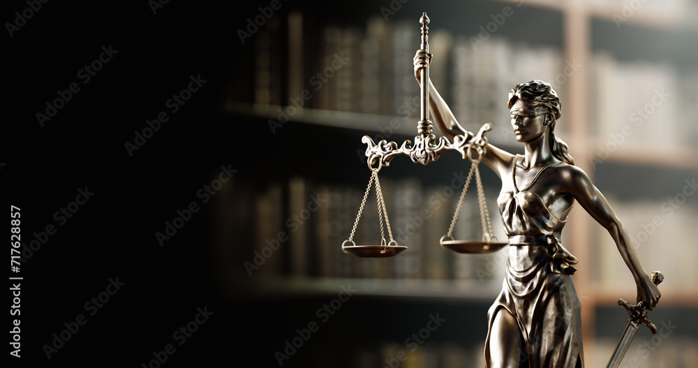 Legal Concept: Themis is the goddess of justice as a symbol of law and order on the background of books - obrazy, fototapety, plakaty 