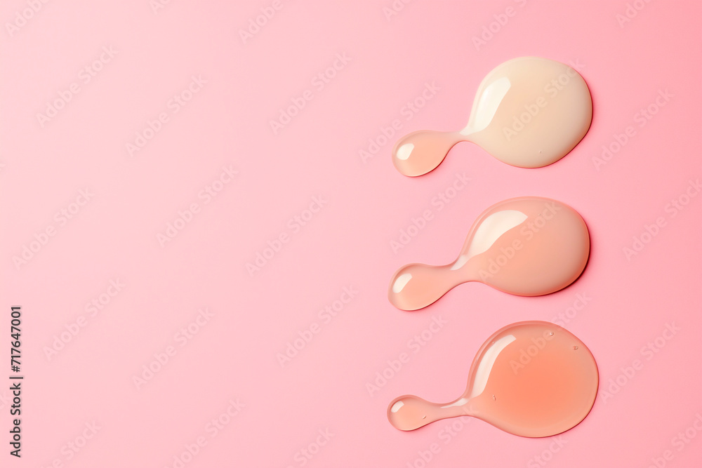 Cosmetic smear cream gel serum texture on pink pastel background Cosmetic smear cream gel serum texture on pink pastel background