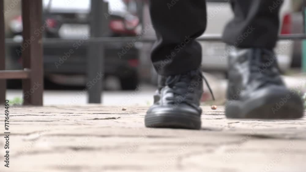 Feet of a child teenager walking on the street road Feet of a child teenager walking on the street road
