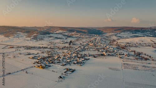Aerial view of a snow-covered idyllic village in Romania photo