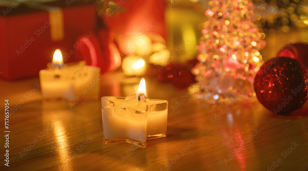 Candlelight and gift box in a Christmas atmosphere. Candlelight and gift box in a Christmas atmosphere.