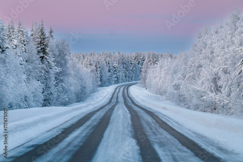 Lapland in winter with large amount of snow during colourful sunset © valdisskudre