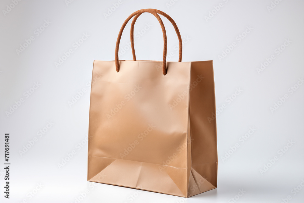 Paper shopping bag on white background. Mockup for your bag design Paper shopping bag on white background. Mockup for your bag design