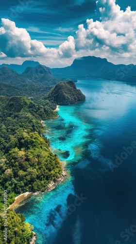 The azure sea and sky embrace the scenic Island, creating a mesmerizing panorama that captures the pristine beauty of tropical paradise from above.