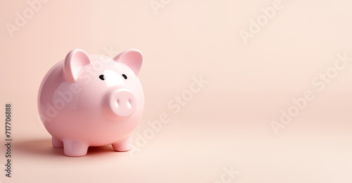 ceramic piggy bank isolated on plain pink studio background on side angle with copy space on right 