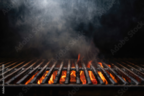 Hot orange flames and smoke rise from a charcoal grill, ready for barbecuing.