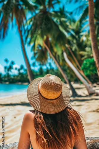 Woman in a hat on the seashore. Selective focus. © yanadjan