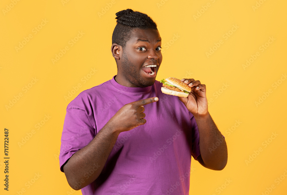 Portrait Of Funny Hungry Black Guy Pointing At Burger Portrait Of Funny Hungry Black Guy Pointing At Burger