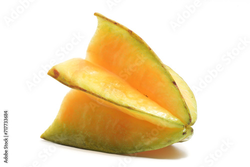 Half cut fresh organic star fruit delicious side view isolated on white background clipping path