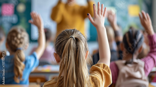 classroom scene with students raising their hands to answer a question or participate in the lesson