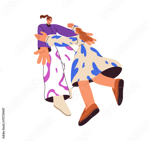 Happy women friends meeting, hugging, greeting each other. Smiling joyful gir...