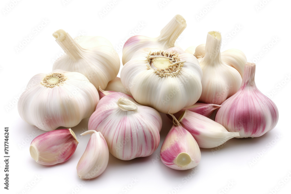 Garlic cloves and garlic bulbs on a white background. Garlic cloves and garlic bulbs on a white background.