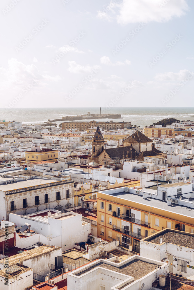 Fototapeta premium Cadiz skyline with a church and fortress of St.Sebastian at the background in Andalusia, Spain.