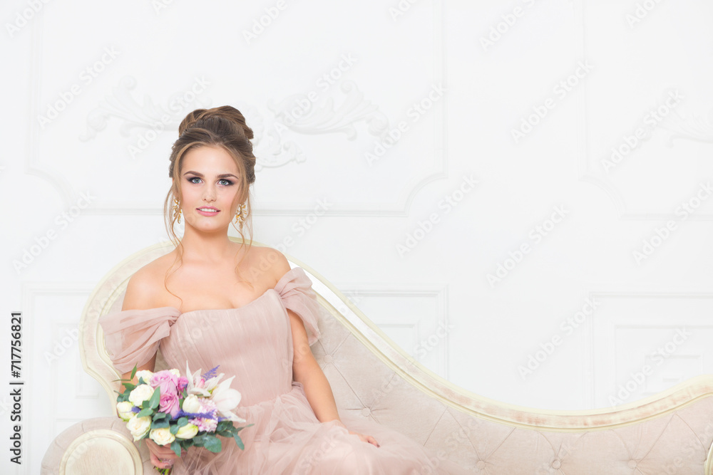Young pretty bride with bridal bouquet indoors Young pretty bride with bridal bouquet indoors