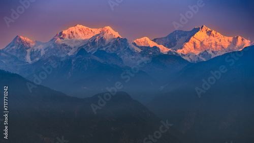 A view of Snow clad Kangchenjunga  also spelled Kanchenjunga the third highest mountain in the world  at the time of Sunrise.