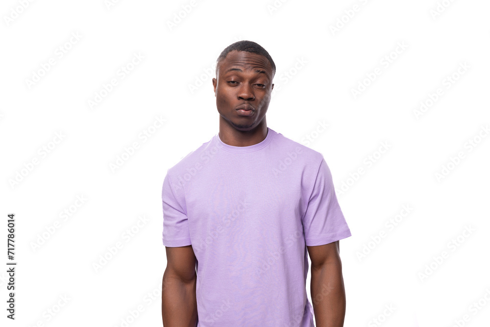 young smart confident american man dressed in light lilac t-shirt young smart confident american man dressed in light lilac t-shirt