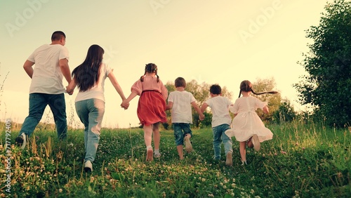 Family, mom, dad, children, play together on weekends outdoors. Happy boy girl run, play together, nature. Kids, parents run in park, friends play in summer. Happy childhood dream, Concept. Friends