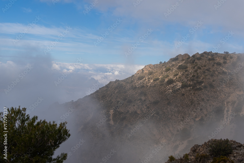 Mountain Ridge Emerging from Mist in Sierra Nevada