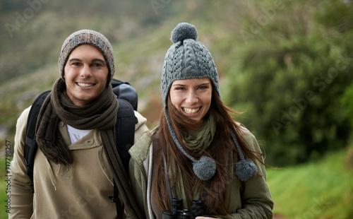 Couple, portrait and hiking in forest or nature for travel, adventure or holiday for experience or fitness. Man, woman or trekking outdoor in woods for cardio, exercise or workout with care or winter