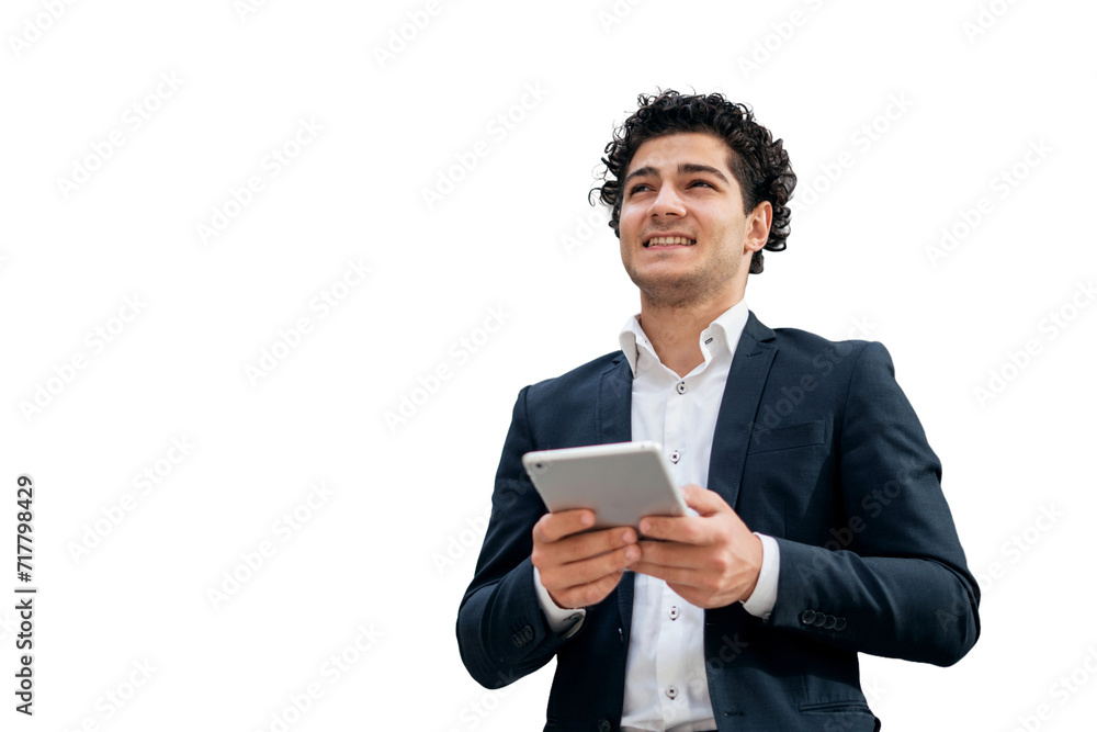 A young businessperson wearing a suit is seen using a tablet, with his eyes averted. The image shows a clear background. A young businessperson wearing a suit is seen using a tablet, with his eyes averted. The image shows a clear background.