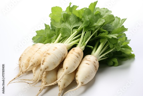 White beet root with green leaves isolated on white background.