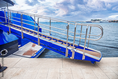 Gangway of a yacht or ship on the pier. photo