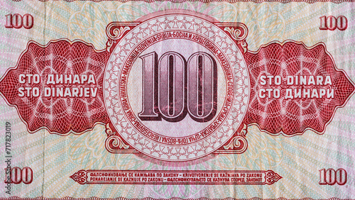 Vintage elements of old paper banknotes.Bonistics.100 Yugoslavian dinars bank note.Fragment  banknote for design purpose. photo