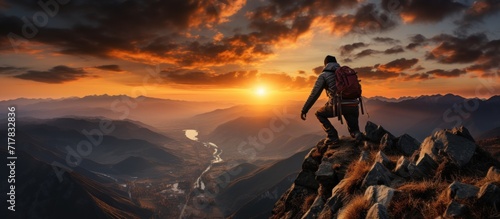 young man Climber on sunset photo