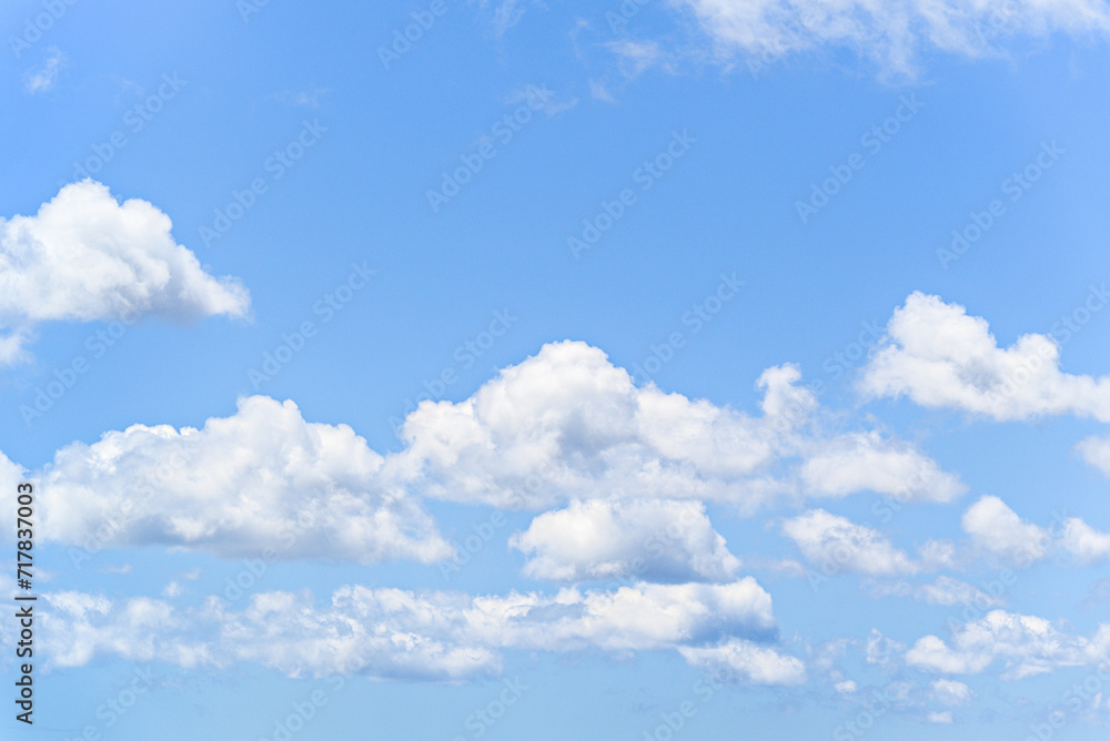 White clouds in a bright blue sky. The beauty of the nature White clouds in a bright blue sky. The beauty of the nature