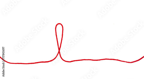 roter Wollfaden auf weißem Untergrund 