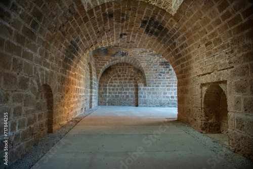 Tunnel passages and walls made of cut stone under Othello Castle. Cyprus historical places. © osman