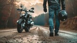 Biker walks to motorcycle holding helmet in hand