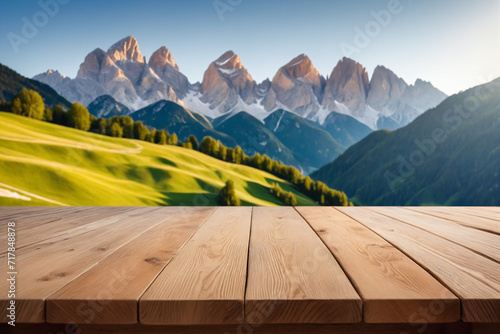 The frontal view of an empty wooden table top with blur background of mountain landscape - Product showing