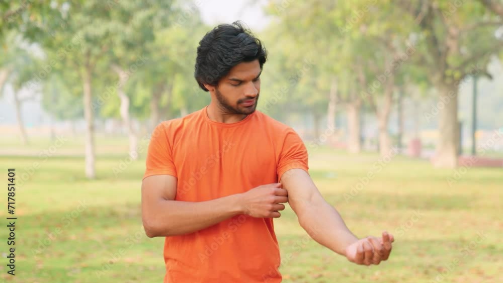 Young Indian Man Adjusting Clothes Young Indian Man Adjusting Clothes