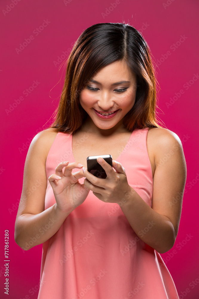 Stylish Chinese Woman using a smart phone. Stylish Chinese Woman using a smart phone.