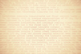 Text written on an old typewriter. It's partly blurred out and in sepia colors