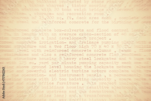 Text written on an old typewriter. It's partly blurred out and in sepia colors photo