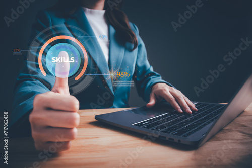 Skill levels growth. Increasing Skill Level. Businesswoman hand is press to the maximum position progress bar with the word SKILLS. Professional, educational knowledge, human resources concept. photo
