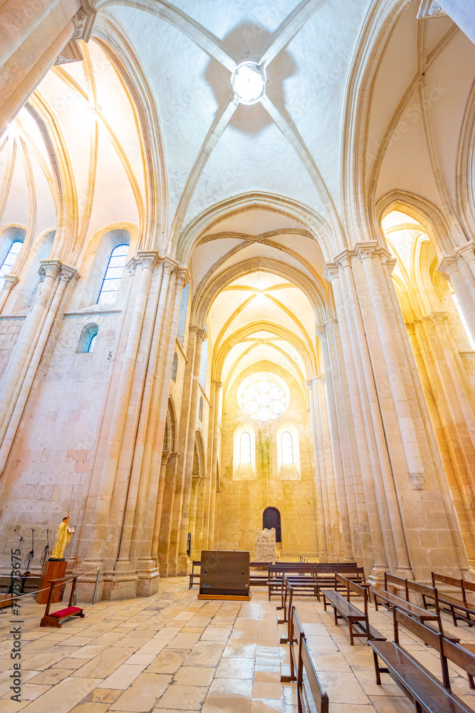 interior of the cloisters of the Batalha monastery seen from the altar. - obrazy, fototapety, plakaty 