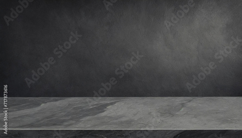 Grey marble tabletop with dark black cement stone background for product displayed in rustic mood and tone photo