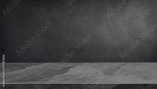 Grey marble tabletop with dark black cement stone background for product displayed in rustic mood and tone